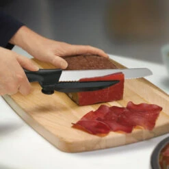 Swiss Classic 8" Serrated DUX-Knife With Adjustable Slicing Guide By Victorinox -Chefs Knives Store vf6866321 thinslices x1000 f5168284 3453 4254 8e48 9d264357fcf8